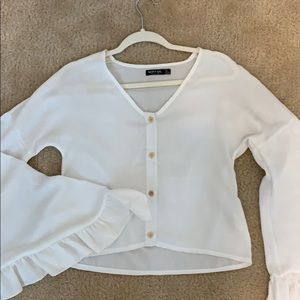 White button up top with bell sleeves